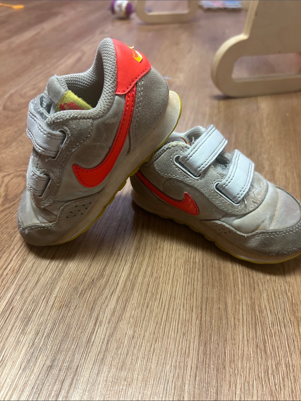 Nike Kids Light Gray Sneakers with Bright Orange Swoosh